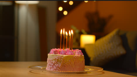 Close-Up-Of-Party-Celebration-Cake-For-Birthday-Decorated-With-Icing-And-Candles-On-Table-At-Home-2